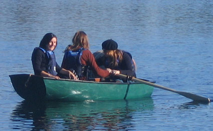 Three adults and a dog